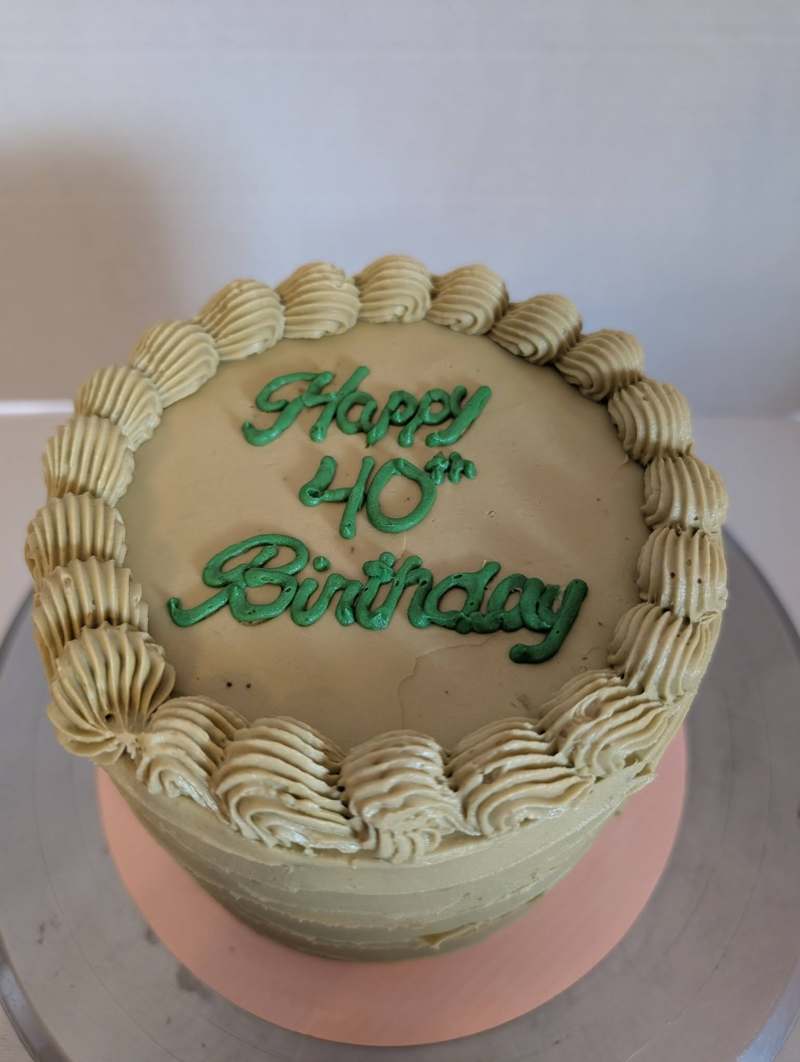 Custom birthday cake with decorative frosting piped on top, made in the Berkshires