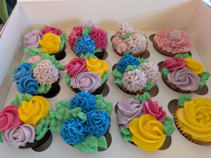 Floral-topped cupcakes styled for a birthday party or bridal shower