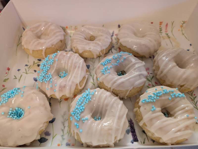 Decorated royal-icing sugar cookies arranged on a serving board